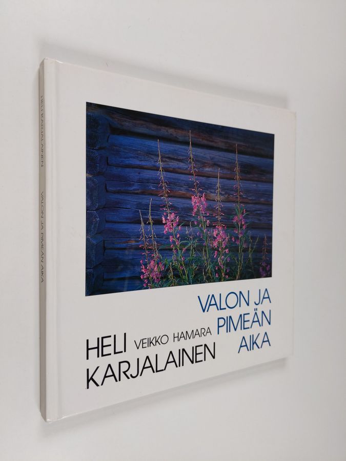 Heli Karjalainen : Valon ja pimeän aika