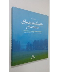 Kirjailijan Ilpo Aalto käytetty kirja Satatuhatta sanaa : värikuvia Etelä-Savosta = A hundred thousand words : colour views of Eastern Finland