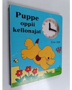 Kirjailijan Eric Hill käytetty kirja Puppe oppii kellonajat