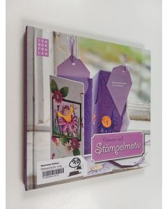 Kirjailijan Marie Andreassen käytetty kirja Dekorera med stämpelmotiv