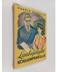 Kirjailijan Kaarlo Nuorvala käytetty kirja Laulajatyttö koulunpenkillä : tyttöromaani