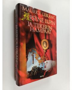 Kirjailijan Maurice Leblanc käytetty kirja Arsene Lupin ja tiikerinhampaat