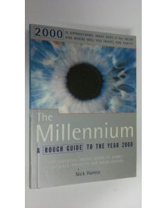 Kirjailijan Nick Hanna käytetty kirja The Millennium : a rough guide to the year 2000; [the essential travel guide to 2000's festivals, projects and mega-events]