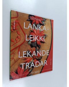 Kirjailijan Ulla Ralli käytetty kirja Lankaleikki : kirjontaa ja paperilankakoristelua = Lekande trådar : broderier och dekorationer med pappersnören