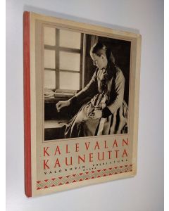 Kirjailijan H. J. ym. Viherjuuri käytetty kirja Kalevalan kauneutta : valokuvin valaistuja runosäkeitä