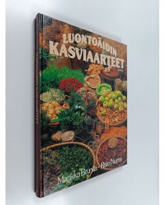 Kirjailijan Marika Brunila käytetty kirja Luontoäidin kasviaarteet