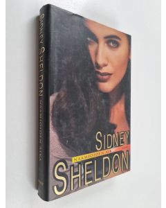 Kirjailijan Sidney Sheldon käytetty kirja Naamioiden aika