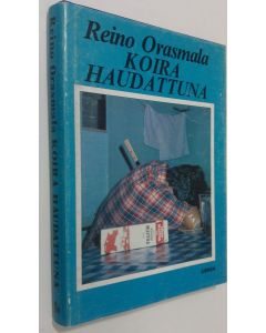 Kirjailijan Reino Orasmala käytetty kirja Koira haudattuna : salapoliisiromaani