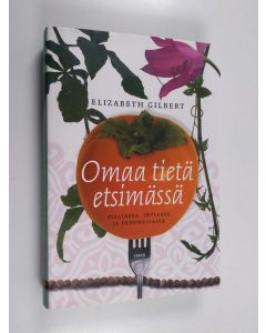 Kirjailijan Elizabeth Gilbert käytetty kirja Omaa tietä etsimässä Italiassa, Intiassa ja Indonesiassa