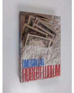 Kirjailijan Robert Ludlum käytetty kirja Omertan laki