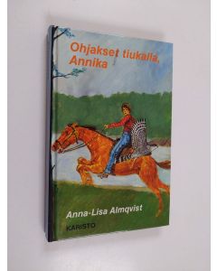 Kirjailijan Anna-Lisa Almqvist käytetty kirja Ohjakset tiukalla, Annika
