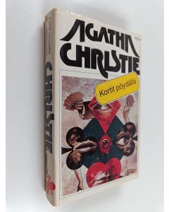 Kirjailijan Agatha Christie käytetty kirja Kortit pöydällä ; Syyttävä sormi