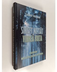 Kirjailijan Sakari Virtanen käytetty kirja Siniset metsät, vihreä kulta : Kainuun metsätalouden historia