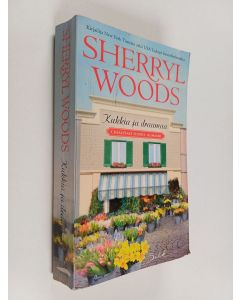 Kirjailijan Sherryl Woods käytetty kirja Kukkia ja draamaa