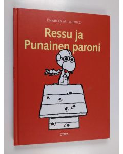 Kirjailijan Charles M. Schulz käytetty kirja Ressu ja Punainen Paroni
