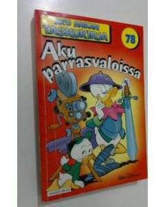 Kirjailijan Walt Disney käytetty kirja Aku parrasvaloissa