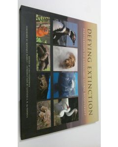 Kirjailijan Lisa Fitzpatrick käytetty kirja Defying Extinction : partnerships to safeguard global biodiversity (ERINOMAINEN)
