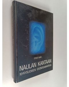 Kirjailijan Erkki Kari käytetty kirja Naulan kantaan : nykysuomen idiomisanakirja