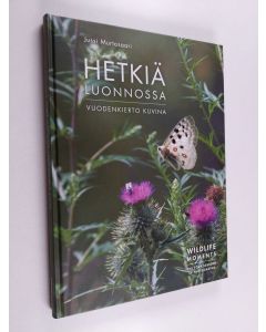 Kirjailijan Jussi Murtosaari käytetty kirja Hetkiä luonnossa : vuodenkierto kuvina = Wildlife moments : the four seasons in photographs
