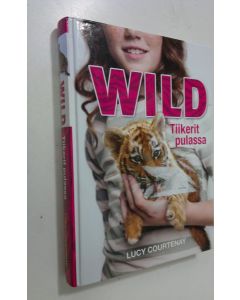 Kirjailijan Lucy Courtenay käytetty kirja Tiikerit pulassa
