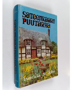 Kirjailijan Patricia M. St. John käytetty kirja Sateenkaaripuutarha