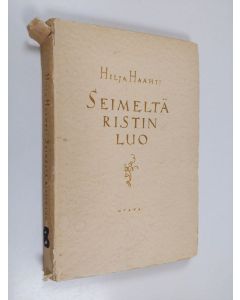 Kirjailijan Hilja Haahti käytetty kirja Seimeltä ristin luo