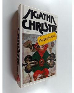 Kirjailijan Agatha Christie käytetty kirja Kortit pöydällä ; Syyttävä sormi
