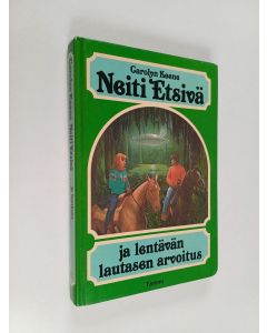Kirjailijan Carolyn Keene käytetty kirja Neiti Etsivä ja lentävän lautasen arvoitus