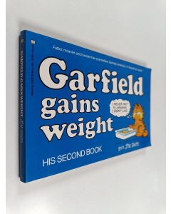 Kirjailijan by Jim Davis käytetty kirja Garfield gains weight