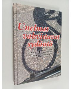 Kirjailijan Veikko Lindberg käytetty kirja Unelmat vahvistavat sydäntä : polkupyörällä Savukoskelta Tuusulan Rantatielle