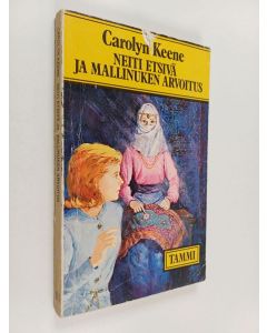 Kirjailijan Carolyn Keene käytetty kirja Neiti Etsivä ja mallinuken arvoitus
