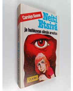 Kirjailijan Carolyn Keene käytetty kirja Neiti Etsivä ja hehkuvan silmän arvoitus
