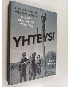 Kirjailijan Jussi Harola käytetty kirja Yhteys! : tiedonanto- ja viestivälineitä Suomen puolustusvoimissa