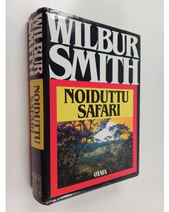 Kirjailijan Wilbur Smith käytetty kirja Noiduttu safari