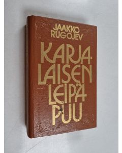 Kirjailijan Jaakko Rugojev käytetty kirja Karjalaisen leipäpuu : valittuja runoja