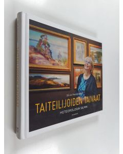 Kirjailijan Seija Paasonen käytetty kirja Taiteilijoiden taivaat : Meteorologin silmin