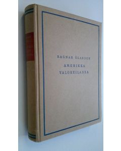Kirjailijan Ragnar Ölander käytetty kirja Amerikka valokeilassa : vaikutelmia matkalta nykypäivien USA:ssa