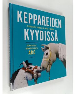 Kirjailijan Sinimaaria Kangas & Lucia Stenger käytetty kirja Keppareiden kyydissä : keppihevosharrastuksen ABC