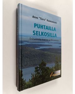 Kirjailijan Arvo Ruonaniemi käytetty kirja Puhtailla selkosilla : erätarinoita Inarista ja Petsamosta