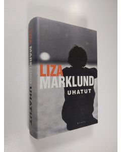 Kirjailijan Liza Marklund käytetty kirja Uhatut