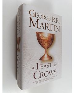 Kirjailijan George R. R. Martin käytetty kirja A feast for Crows