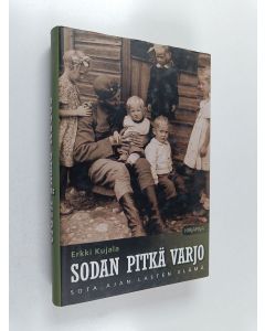 Kirjailijan Erkki Kujala käytetty kirja Sodan pitkä varjo : sota-ajan lasten elämä
