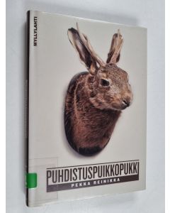 Kirjailijan Pekka Reinikka käytetty kirja Puhdistuspuikkopukki : hieman pitempiä erävirsiä