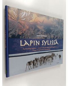 Kirjailijan Tapio Huttunen käytetty kirja Lapin sylissä : Enchanting Lapland : Laissez-vous envoûter par la Laponie! : Ocero ocarovanie Laplandii
