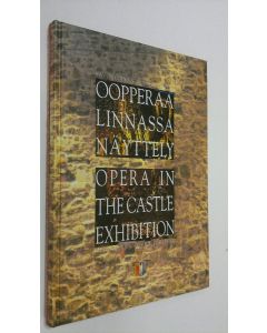 Kirjailijan Susan Sinisalo käytetty kirja Oopperaa linnassa : Savonlinnan oopperajuhlien 30-vuotisjuhlanäyttely = Opera in the castle : exhibition in honour of the 30th anniversary of the Savonlinna Opera Festival