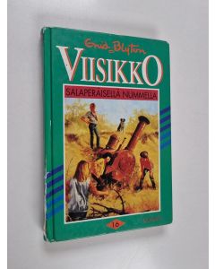 Kirjailijan Enid Blyton käytetty kirja Viisikko salaperäisellä nummella