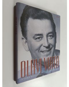 Kirjailijan Lasse Erola käytetty kirja Olavi Virta ja hänen maailmansa (ERINOMAINEN)