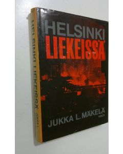 Kirjailijan Jukka L. Mäkelä käytetty kirja Helsinki liekeissä : Suurpommitukset helmikuussa 1944