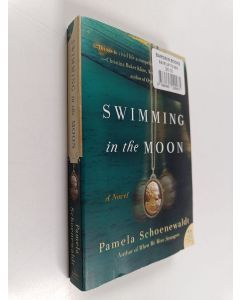 Kirjailijan Pamela Schoenewaldt käytetty kirja Swimming in the Moon - A Novel