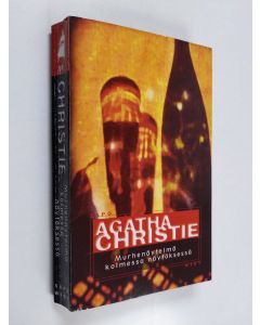 Kirjailijan Agatha Christie käytetty kirja Murhenäytelmä kolmessa näytöksessä